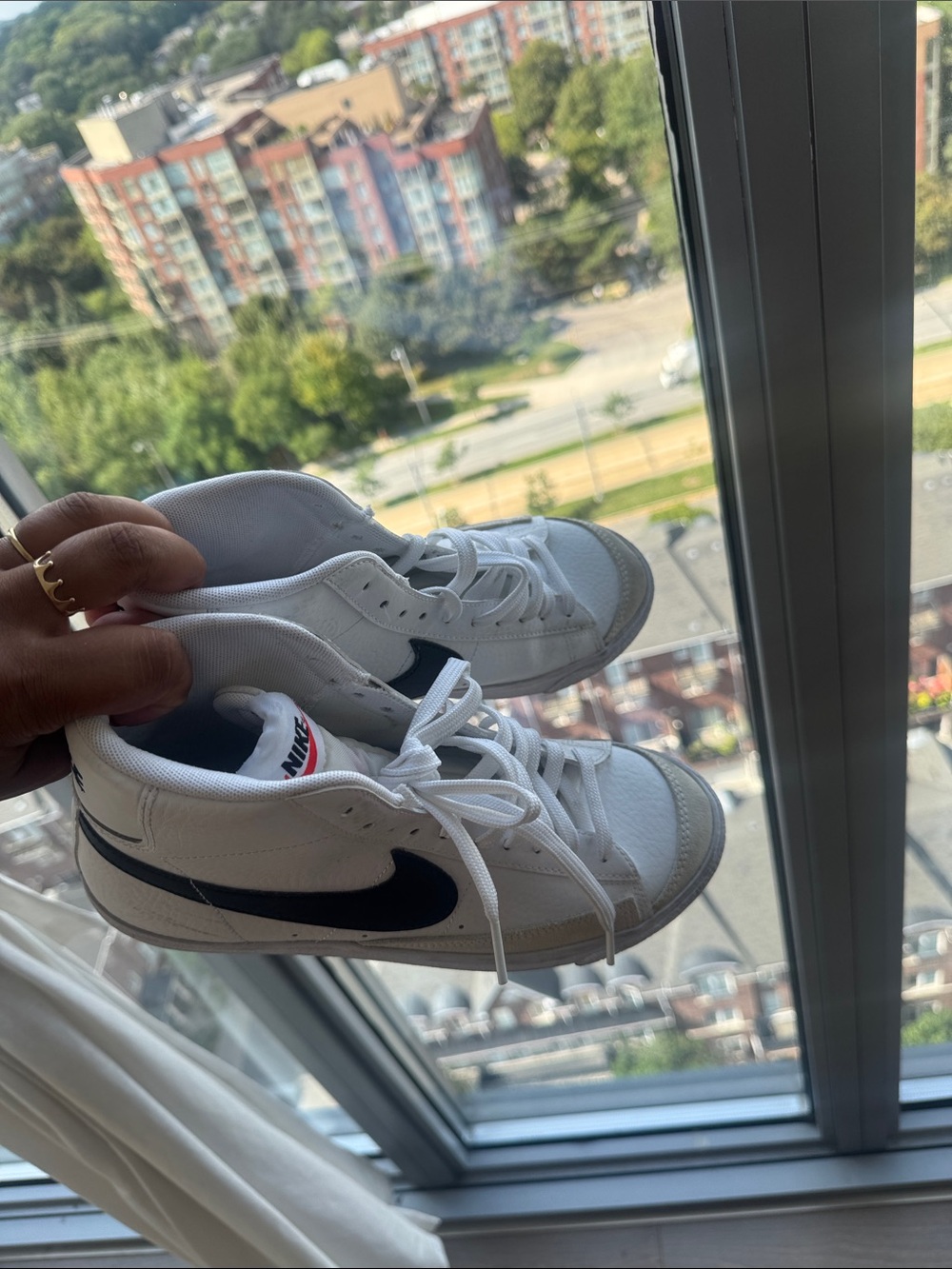 Nike Kids White Sneakers with Black Swoosh